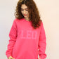 Pink Zodiac Puff Print Crewneck